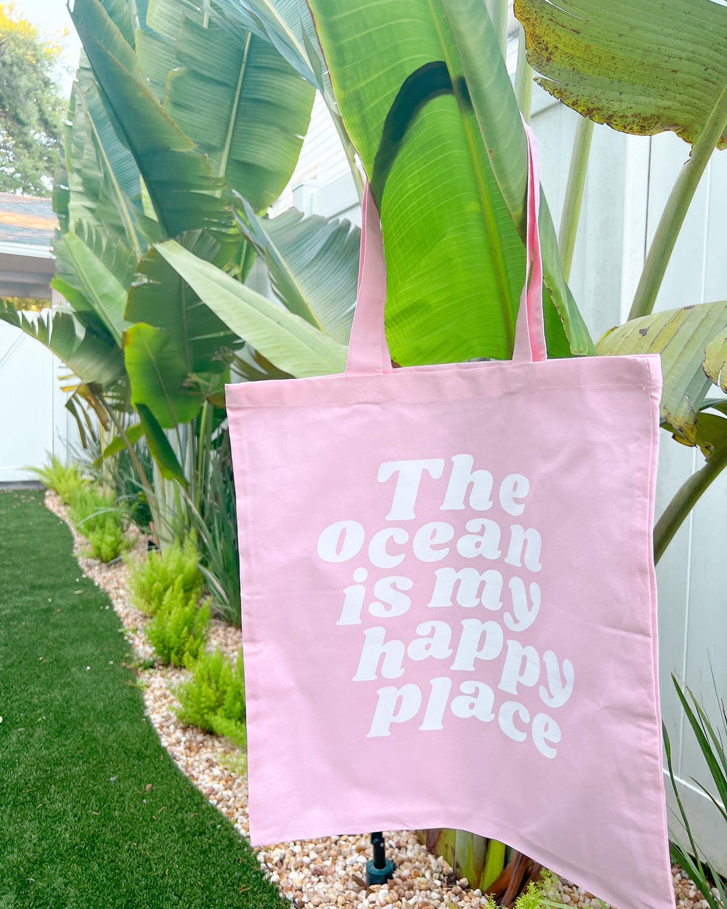 The ocean is my happy place tote bags